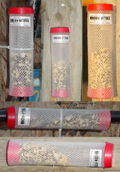 Various ways to mount Rincon-Vitova fly parasite release stations for dispensing beneficial wasps for fly control.